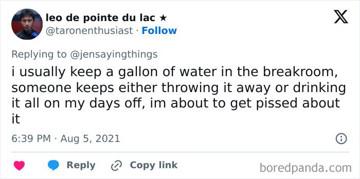 A tweet about a gallon of water in the breakroom being consistently thrown away or drunk, showcasing office food thief scenarios.