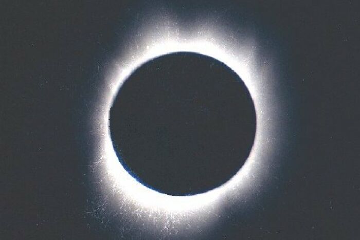 Extraordinary solar eclipse photo, showcasing the sun's corona during totality.