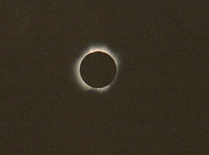 Extraordinary solar eclipse photo, a celestial event captured against a darkened sky.