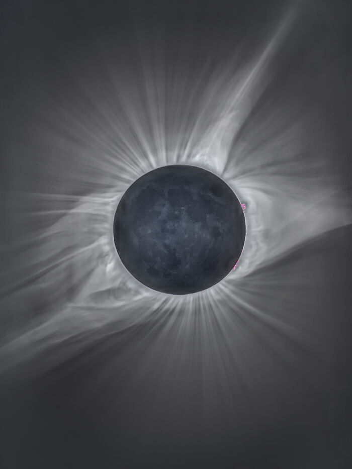 Extraordinary solar eclipse photo showcasing detailed corona streamers, making history.