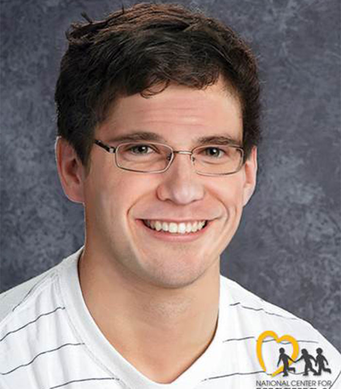 A young man in glasses smiles at the camera after a car crash, sparking an investigation into unexplained events.