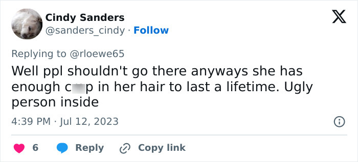 A social media comment about a hair salon owner, criticizing her appearance and calling her an ugly person inside. A social media comment about a hair salon owner, criticizing her appearance and calling her an ugly person inside.