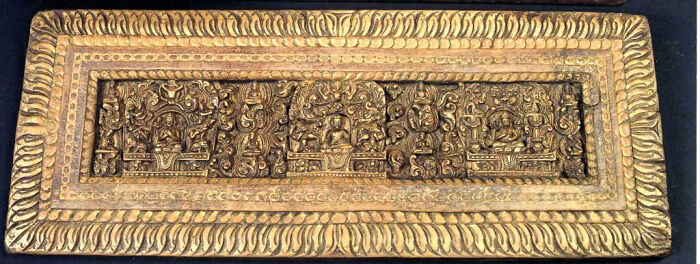 An intricately carved golden historical artifact with multiple figures in relief, showcasing details that survived against the odds.