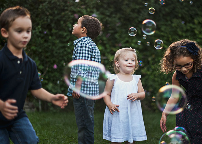Children playing with bubbles, a doctor shares five things parents should never allow children to do.