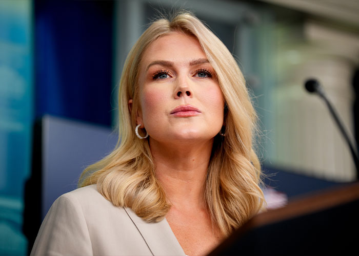 Karoline Leavitt as Press Secretary, looking thoughtful, amidst scrutiny over her sudden exit.