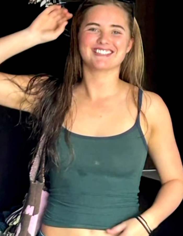 Happy teen girl in a green top, key to the missing teen investigation.
