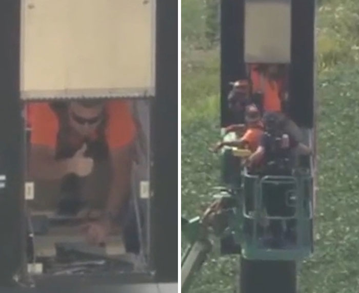 An electrician stuck inside a 130ft high sign, rescued by emergency services in a crane.