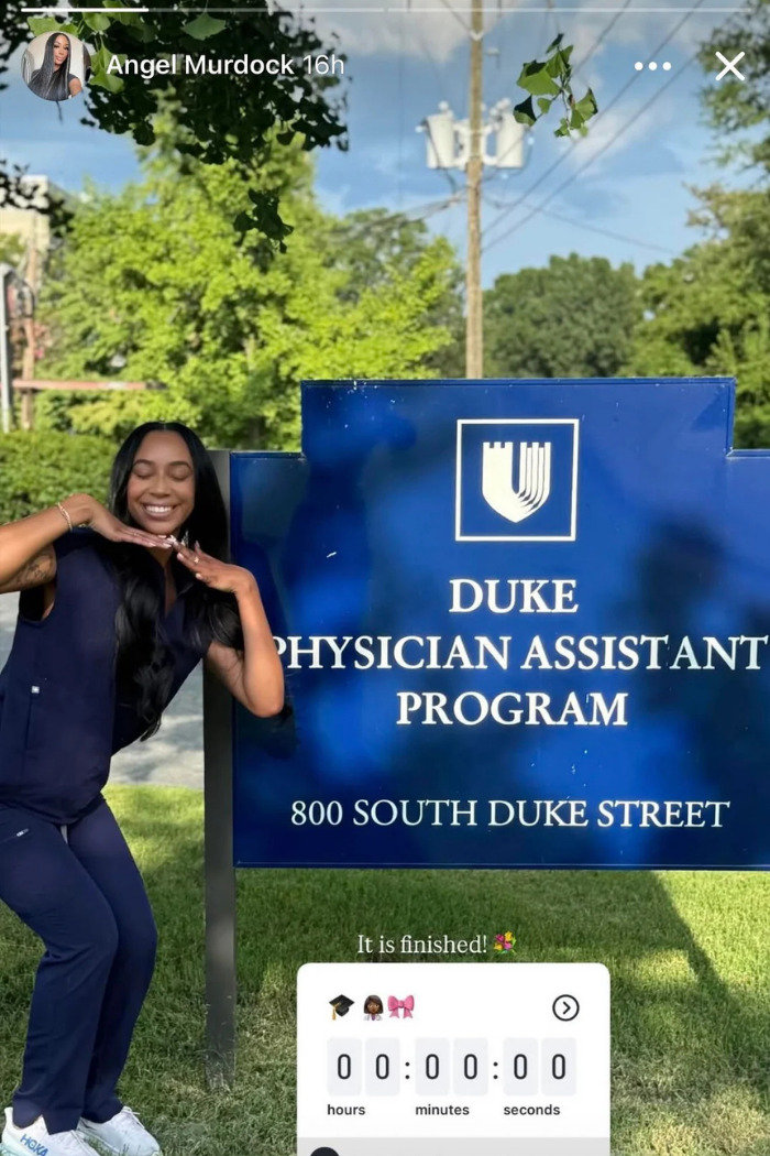 Influencer smiling in scrubs by Duke Physician Assistant Program sign, celebrating career journey milestone. Influencer smiling in scrubs by Duke Physician Assistant Program sign, celebrating career journey milestone.