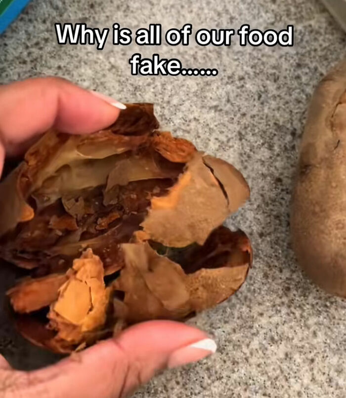 A hand holding a shriveled, oddly textured fruit with text asking Why is all of our food fake....., about fake foods Americans eat everyday. A hand holding a shriveled, oddly textured fruit with text asking Why is all of our food fake....., about fake foods Americans eat everyday.