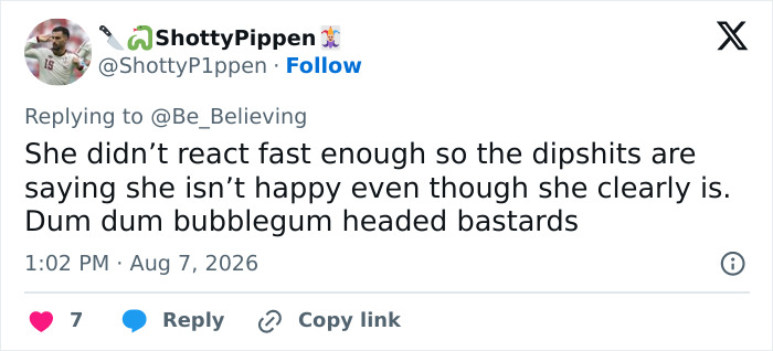 A tweet by ShottyPippen, @ShottyP1ppen, saying, She didn't react fast enough so the dipshits are saying she isn't happy even though she clearly is, regarding the family surprise.