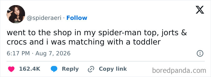 Tweet from spideraeri about matching outfits with a toddler, underscoring the comedy of raising kids.