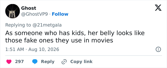 Screenshot of a tweet by Ghost commenting on Anne Hathaway's red carpet maternity outfit, sparking pregnancy theories.
