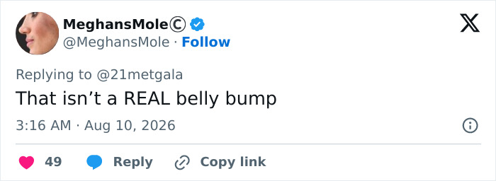 Screenshot of a tweet by MeghansMole questioning Anne Hathaway's red carpet maternity outfit, sparking pregnancy theories.