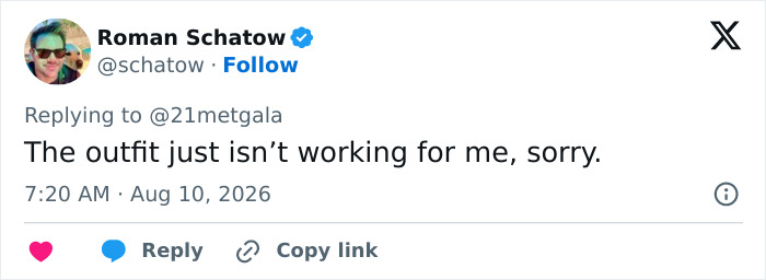 Screenshot of a tweet by Roman Schatow expressing dislike for Anne Hathaway's red carpet maternity outfit, sparking pregnancy theories.