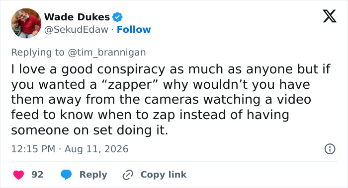 A tweet discussing a conspiracy theory related to the mystery woman and her strange gesture. A tweet discussing a conspiracy theory related to the mystery woman and her strange gesture.