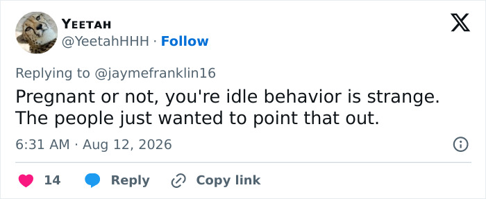 Tweet from YEETAH about idle and strange behavior, pointing out the mystery woman's gesture.