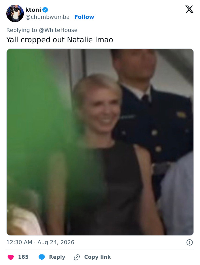 Screenshot of a tweet showing Natalie Harp smiling, with text noting she was cropped out. Screenshot of a tweet showing Natalie Harp smiling, with text noting she was cropped out.