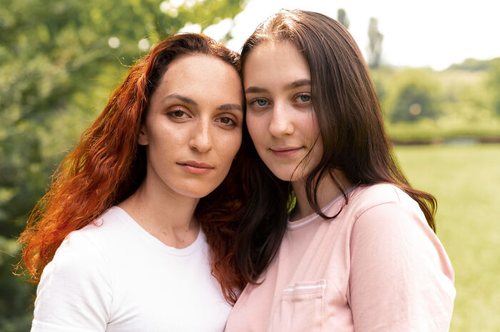 Two women, one with red hair, the other with brown, share a close bond and a secret they'd never confess.