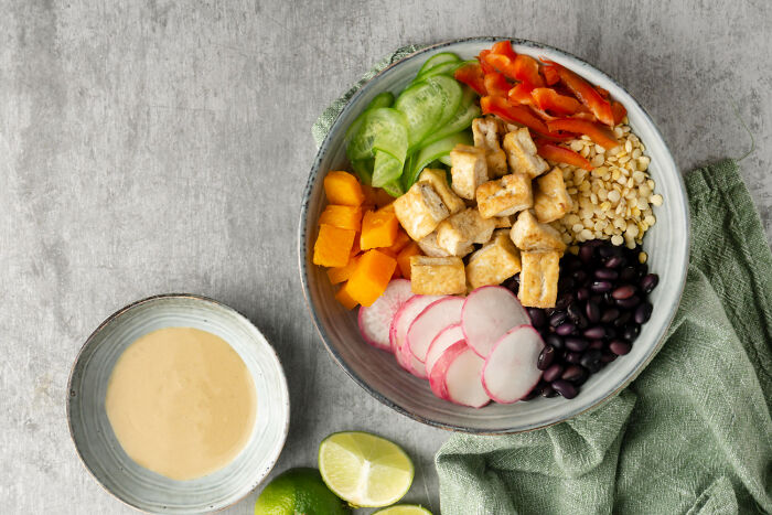 A healthy bowl with various ingredients, illustrating smart food choices that are good poverty habits for women.