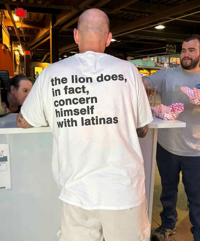 A man wearing an iconic shirt that says the lion does, in fact, concern himself with latinas.
