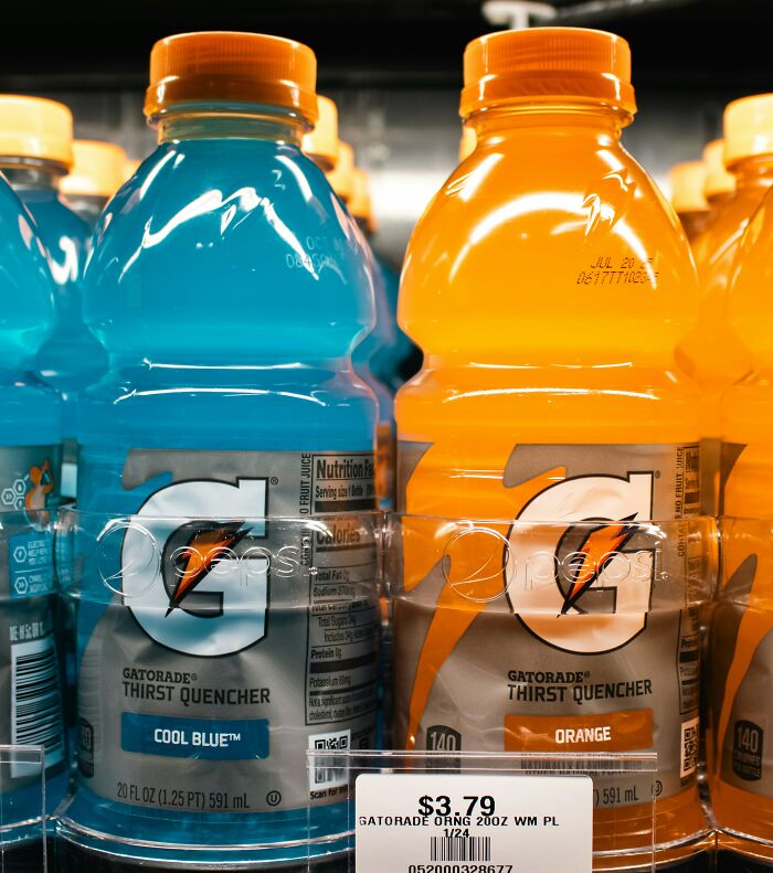 Rows of blue Cool Blue and orange Gatorade Thirst Quencher bottles, illustrating common healthy habits and sports hydration.