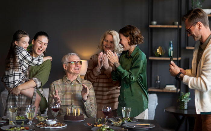 A happy family is celebrating a birthday with a cake, and a couple decided not to house their niece. A happy family is celebrating a birthday with a cake, and a couple decided not to house their niece.