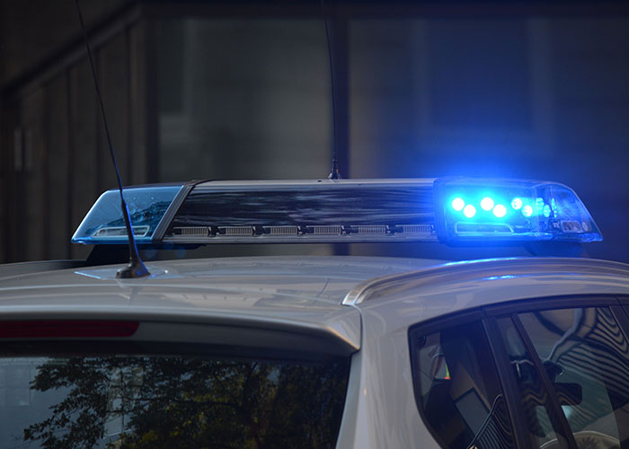A police car's flashing blue lights, possibly indicating a dramatic or bad first date.