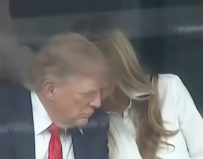 A close-up shot of Melania and Donald Trump at IndyCar Event with the main SEO keyword 'Lip Reader Decodes Heated Exchange'. A close-up shot of Melania and Donald Trump at IndyCar Event with the main SEO keyword 'Lip Reader Decodes Heated Exchange'.
