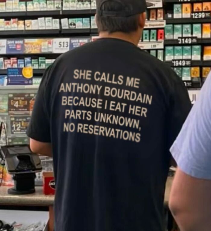 A black t-shirt with iconic shirts text: She calls me Anthony Bourdain because I eat her parts unknown, no reservations.