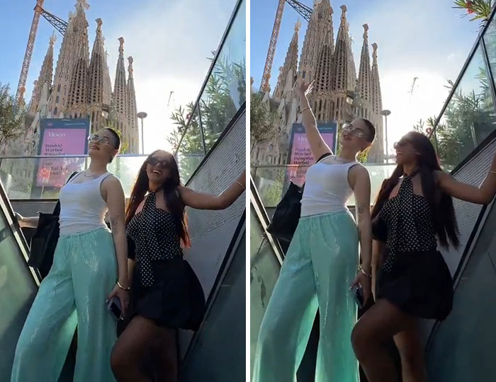 Two women filming a video on a busy metro station escalator, causing a disturbance. Two women filming a video on a busy metro station escalator, causing a disturbance.