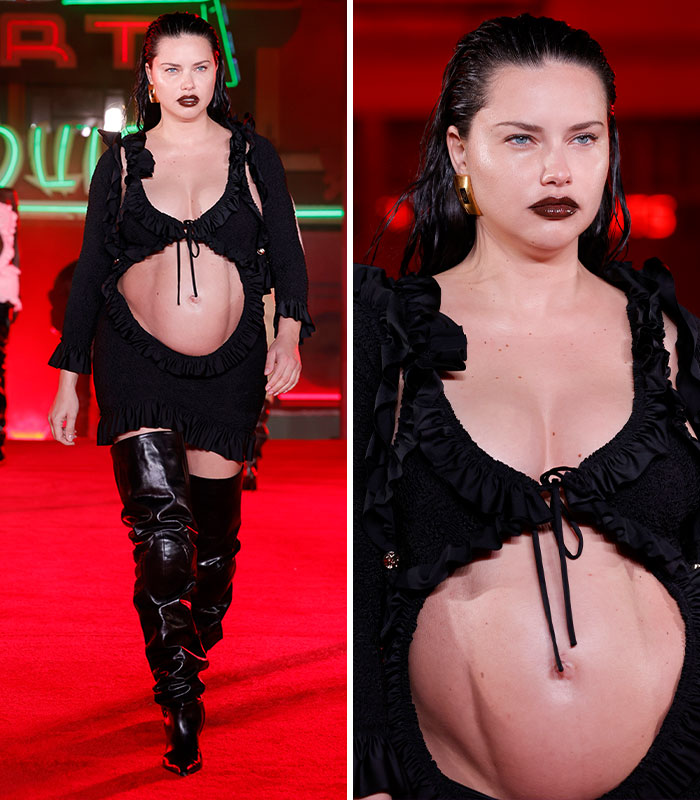 Adriana Lima on the runway, revealing her belly in a black ruffled top and skirt, a daring celebrity pregnancy look.