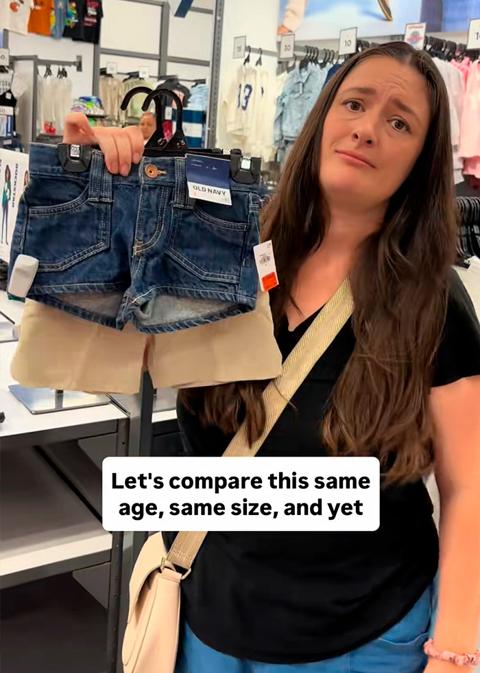 Shopper holding up two pairs of back-to-school kids clothing shorts, one khaki and one denim, highlighting a concerning trend. Shopper holding up two pairs of back-to-school kids clothing shorts, one khaki and one denim, highlighting a concerning trend.