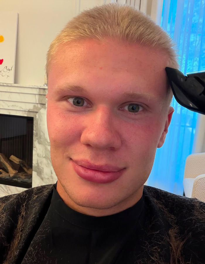 Erling Haaland during his haircut, getting his blond locks chopped off with clippers. Erling Haaland during his haircut, getting his blond locks chopped off with clippers.