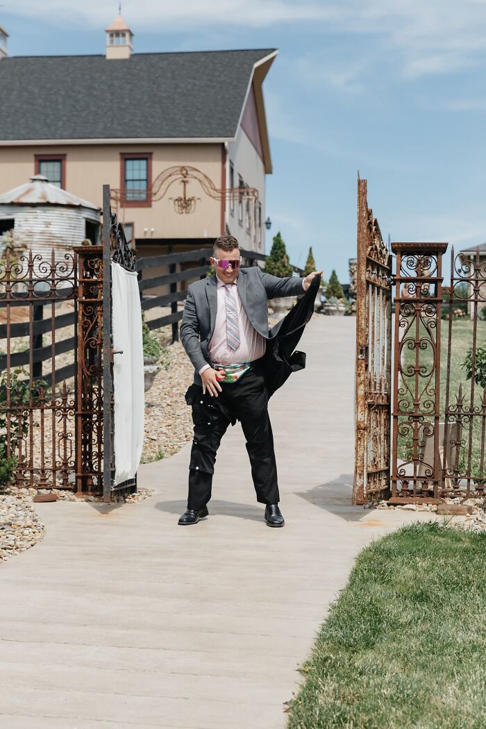 A groom pulling down his pants, creating a funny and iconic wedding photo.