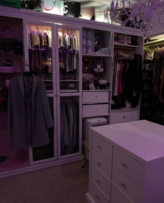 A DIY home project: a walk-in closet with custom white built-ins and purple lighting, demonstrating space transformation.