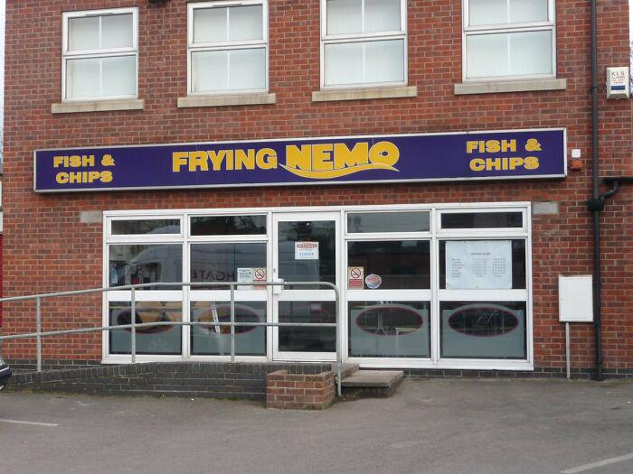 A British fish and chips shop with the humorous name Frying Nemo, a prime example of dry British humor.