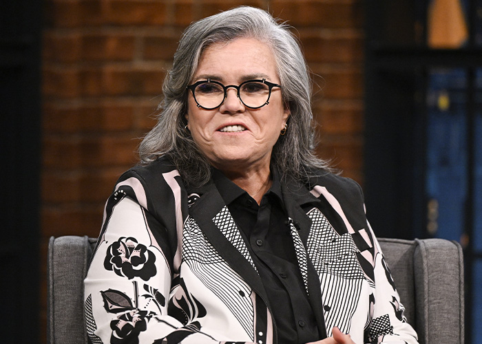 Rosie O'Donnell in glasses and a patterned jacket discussing Trump rumors on Jimmy Kimmel.