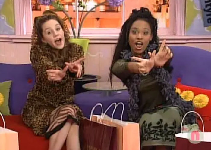 Nickelodeon star Christy Knowings and a co-star on All That, both pointing forward with excitement. Nickelodeon star Christy Knowings and a co-star on All That, both pointing forward with excitement.