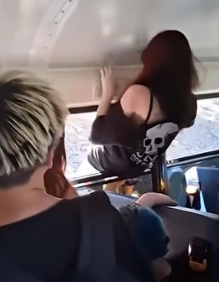 Furious parent getting inside school bus through a window, after driver refuses to release kids. Furious parent getting inside school bus through a window, after driver refuses to release kids.