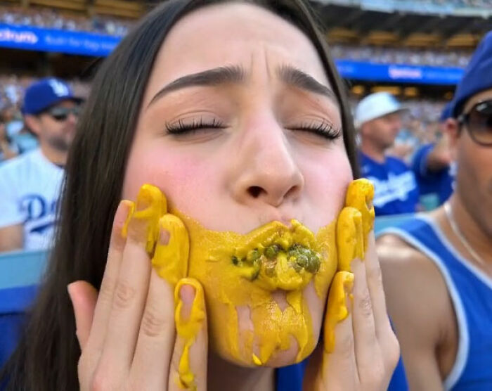 Mario Lopez's niece, with yellow mustard and relish smeared on her face, looks upset as she is roasted online.