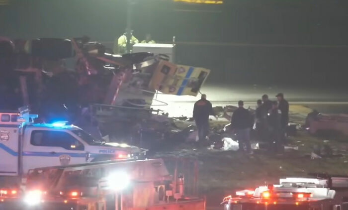 Debris and emergency vehicles at the scene of the Air Canada crash, highlighting the severity of the incident. Debris and emergency vehicles at the scene of the Air Canada crash, highlighting the severity of the incident.
