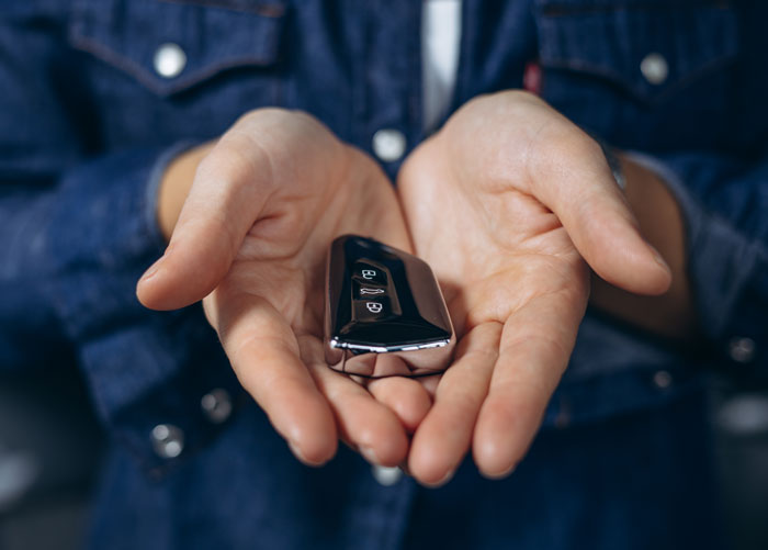 Influencer shares safety tips. A person holds car keys, ready for quick access to stay safe. Influencer shares safety tips. A person holds car keys, ready for quick access to stay safe.
