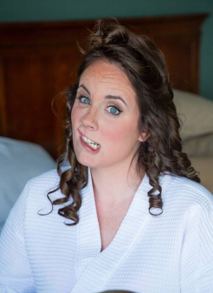 A bride making a funny face, capturing one of the iconic funny wedding photos.