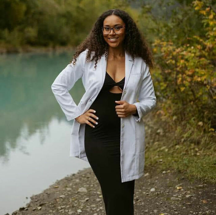 A surrogate woman, McKenna, smiling outdoors, a key figure in the case to save baby after biological parents demand pregnancy termination.