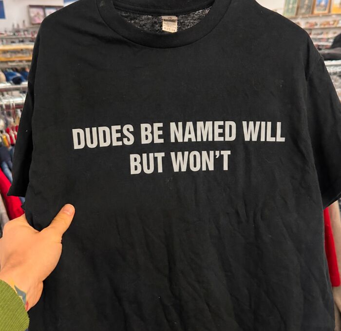 A black iconic shirt with white text: DUDES BE NAMED WILL BUT WON'T.