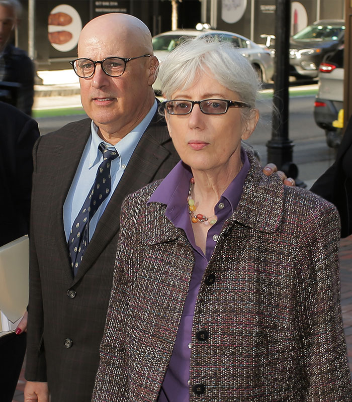An old couple, a man and a woman, walking together, representing the old couple's lives impacted by the eBay campaign.