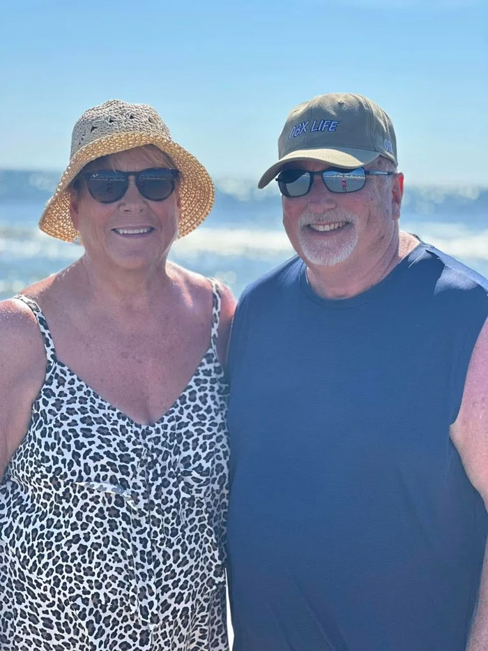 A happy couple on the beach, the parents from a large family who keep adopting kids. A happy couple on the beach, the parents from a large family who keep adopting kids.