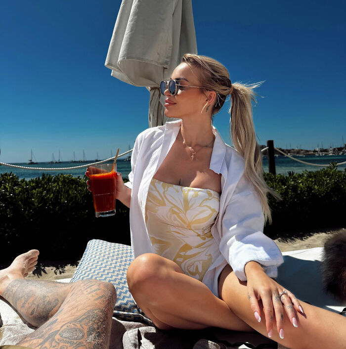 Young woman on a Bali vacation, enjoying the sun while reminding travelers to be careful after her nightmare experience.
