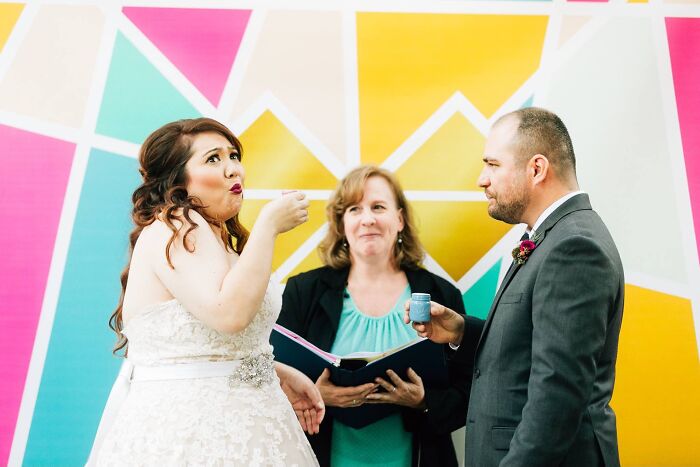 Bride and groom exchanging unusual items during a ceremony, a truly funny wedding photo.