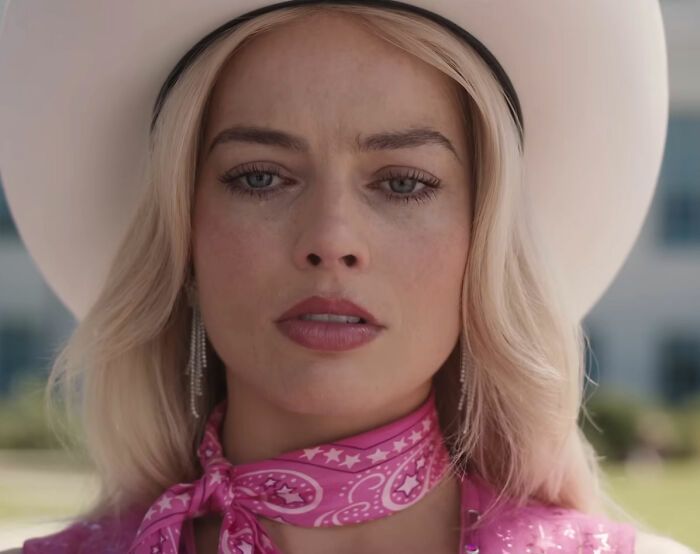 Margot Robbie as Barbie, in a white cowboy hat and pink bandana, sparking rumors about a blockbuster franchise role. Margot Robbie as Barbie, in a white cowboy hat and pink bandana, sparking rumors about a blockbuster franchise role.